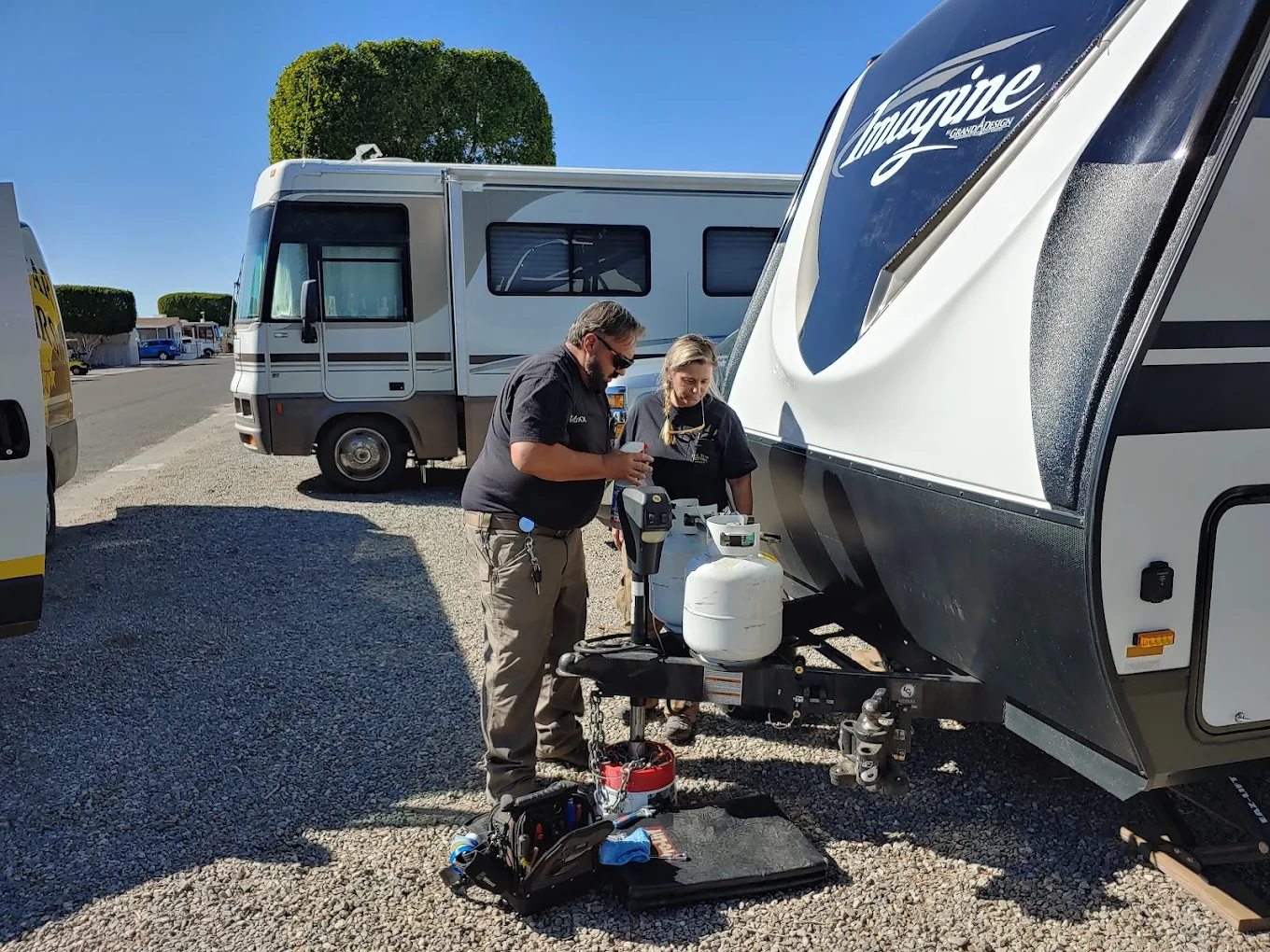 Technicians working on RV propane regulator