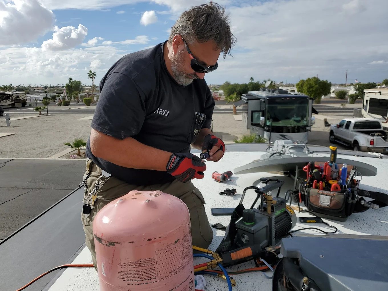 Technician servicing an RV air conditioner